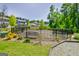 Fenced dog park area offering a safe space for pets to play and socialize with a bench at 221 Caledonia Ct, Peachtree City, GA 30269