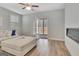 Cozy living room with patio access, a modern fireplace, and light wood flooring at 221 Caledonia Ct, Peachtree City, GA 30269