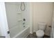 Bright bathroom featuring a shower and tub combination and a standard toilet at 443 Faulkner St, Stockbridge, GA 30281