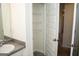 Bright bathroom features wire shelving in an adjacent closet and a sink at 443 Faulkner St, Stockbridge, GA 30281
