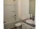 Bathroom with white sink, toilet, and tub with shower at 443 Faulkner St, Stockbridge, GA 30281