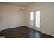 Dining room with hardwood floors, a chandelier, and a door to the outside at 443 Faulkner St, Stockbridge, GA 30281