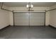 Clean, bright garage featuring a sealed floor and insulated garage door at 443 Faulkner St, Stockbridge, GA 30281