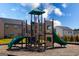 Community playground with climbing features, slides, and safety surfacing in a residential neighborhood at 443 Faulkner St, Stockbridge, GA 30281
