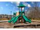 Green and tan playground featuring multiple slides, climbing structures, and a protective mulch surface at 443 Faulkner St, Stockbridge, GA 30281