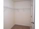 Walk-in closet with wire shelving and carpeted flooring for ample storage at 443 Faulkner St, Stockbridge, GA 30281