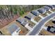 An aerial view captures a neighborhood with manicured lawns, tree-lined streets, and a mix of two-story homes at 1659 Hay Patch Ln, Loganville, GA 30052