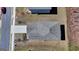 An aerial view focuses on the layout of the roof and the driveway at 1659 Hay Patch Ln, Loganville, GA 30052
