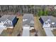 An aerial view of the house shows its architectural features and landscaping at 1659 Hay Patch Ln, Loganville, GA 30052