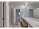 View of bathroom with double sinks, shower stall and connection to bedroom at 1659 Hay Patch Ln, Loganville, GA 30052