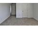 Bedroom with neutral carpet, bright lighting, and ample doorway access at 1659 Hay Patch Ln, Loganville, GA 30052