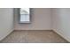 Carpeted bedroom with a window, perfect for relaxation and comfort at 1659 Hay Patch Ln, Loganville, GA 30052