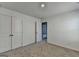 Bright bedroom with neutral carpeting, a closet and white walls at 1659 Hay Patch Ln, Loganville, GA 30052