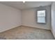 Comfortable bedroom with soft carpeting, a bright window, and plenty of space at 1659 Hay Patch Ln, Loganville, GA 30052