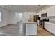 Open kitchen with a large island and modern appliances offers ample counter space at 1659 Hay Patch Ln, Loganville, GA 30052
