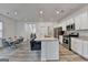 Open-concept kitchen with stainless steel appliances, large island, and hardwood floors at 1659 Hay Patch Ln, Loganville, GA 30052