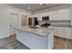 Kitchen island has stainless steel sink, granite countertop, and white base at 1659 Hay Patch Ln, Loganville, GA 30052