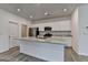 Kitchen features an expansive island with stainless steel sink, granite countertops and storage at 1659 Hay Patch Ln, Loganville, GA 30052
