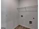 Laundry room with wire shelf and washer-dryer hookups at 1659 Hay Patch Ln, Loganville, GA 30052