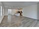 Open-concept living space with durable flooring connecting to the kitchen and dining areas at 1659 Hay Patch Ln, Loganville, GA 30052