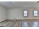 Bright living room with durable flooring and large windows filling the room with natural light at 1659 Hay Patch Ln, Loganville, GA 30052