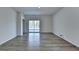 Spacious living room featuring durable flooring, modern sliding doors, and ample natural light at 1659 Hay Patch Ln, Loganville, GA 30052