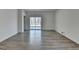 Large living room with durable flooring and sliding doors, offering easy access to the backyard at 1659 Hay Patch Ln, Loganville, GA 30052
