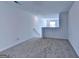 Spacious carpeted loft area filled with natural light, perfect for a home office or play area at 1659 Hay Patch Ln, Loganville, GA 30052