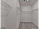 Walk-in closet with wire shelving and neutral carpet at 1659 Hay Patch Ln, Loganville, GA 30052