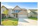 Inviting two-story home with a well-manicured lawn and a spacious two-car garage at 2376 Aukerman Trce, Hampton, GA 30228