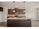 Gourmet kitchen with a large island, granite countertops, and stainless steel appliances at 2376 Aukerman Trce, Hampton, GA 30228