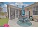 Charming back patio with outdoor dining and access to the screened in porch at 221 Collierstown Way, Peachtree City, GA 30269