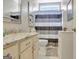 Well-lit bathroom with a granite countertop vanity, framed mirror and striped shower curtain at 221 Collierstown Way, Peachtree City, GA 30269