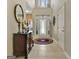 Inviting foyer featuring tile flooring and a decorative chest with mirror at 221 Collierstown Way, Peachtree City, GA 30269