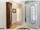 Bright foyer with tiled floors and decorative glass front door at 221 Collierstown Way, Peachtree City, GA 30269