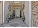 Cozy front porch with decorative plants and a small table and chairs at 221 Collierstown Way, Peachtree City, GA 30269