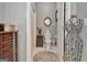 Powder room with white toilet, decorative mirror, a small cabinet and tiled floor at 221 Collierstown Way, Peachtree City, GA 30269