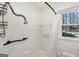 Bright bathroom with a shower-tub combo and grab bar at 179 Green Valley Rd, Fayetteville, GA 30214