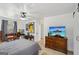 Spacious bedroom features nice hardwood floors, a ceiling fan, and a mounted television at 179 Green Valley Rd, Fayetteville, GA 30214