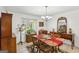 Bright dining room with wooden table and chairs next to a window at 179 Green Valley Rd, Fayetteville, GA 30214