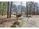 A single-story home with a long driveway, nestled amongst mature trees at 179 Green Valley Rd, Fayetteville, GA 30214