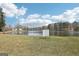 Scenic lake view from private property with a 'No Trespassing' sign posted near the grassy shoreline at 179 Green Valley Rd, Fayetteville, GA 30214