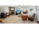 Spacious living room with brick fireplace, wood flooring, and view into dining room at 179 Green Valley Rd, Fayetteville, GA 30214
