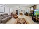 Open-concept living room featuring a brick fireplace and ample natural light at 179 Green Valley Rd, Fayetteville, GA 30214
