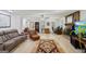 Expansive living room with a fireplace, multiple seating areas, and natural light from several windows at 179 Green Valley Rd, Fayetteville, GA 30214