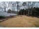 Spacious backyard featuring a cozy fire pit area with seating, perfect for outdoor gatherings at 90 Oak Walk, Villa Rica, GA 30180
