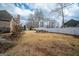 Expansive backyard with a firepit surrounded by chairs and a white privacy fence at 90 Oak Walk, Villa Rica, GA 30180