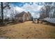 Large backyard featuring outdoor seating and white privacy fence at 90 Oak Walk, Villa Rica, GA 30180
