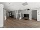 Open basement area with stairs, a movie projector and exercise equipment in the distance at 90 Oak Walk, Villa Rica, GA 30180