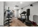 Basement area with home gym featuring treadmill, weight machine and other gym equipment at 90 Oak Walk, Villa Rica, GA 30180